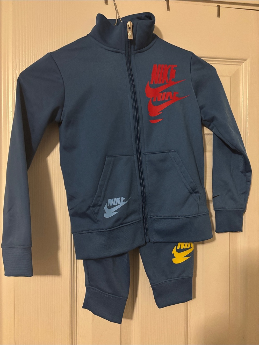 Nike Blue Kids Track Jacket & Joggers Set with Red and Yellow Logos